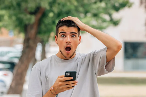 Young Man Street Mobile Phone Reacting Surprised — Stock Photo, Image
