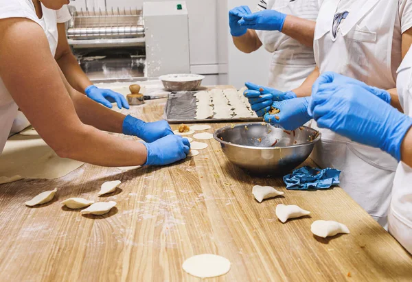 The process of preparing food from dough in the kitchen. High quality photo