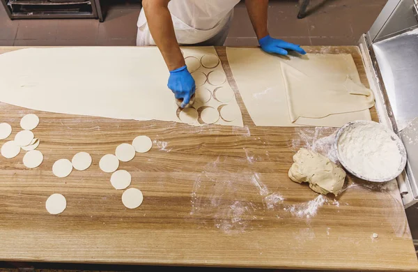 The process of preparing food from dough in the kitchen. High quality photo