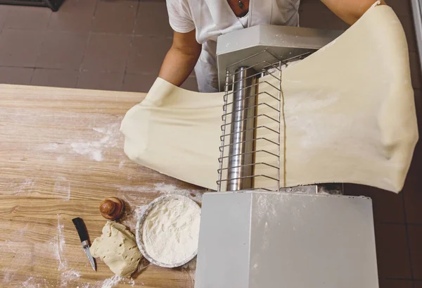 The process of preparing food from dough in the kitchen. High quality photo