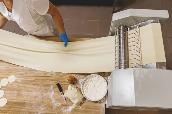 The process of preparing food from dough in the kitchen. High quality photo