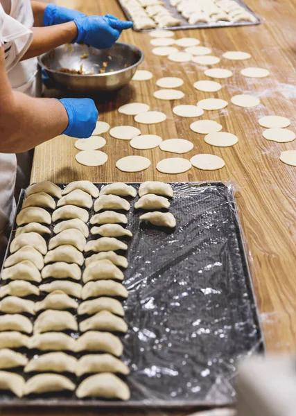 The process of preparing food from dough in the kitchen. High quality photo