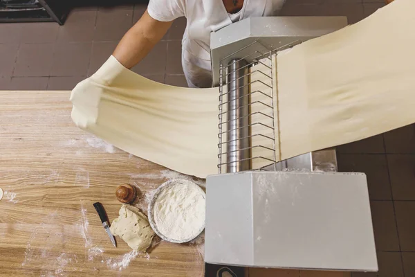 The process of preparing food from dough in the kitchen. High quality photo