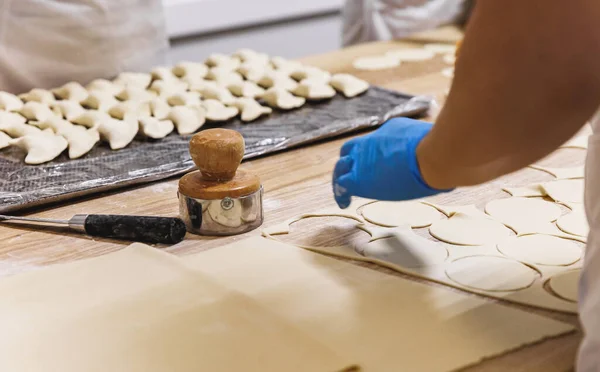 The process of preparing food from dough in the kitchen. High quality photo