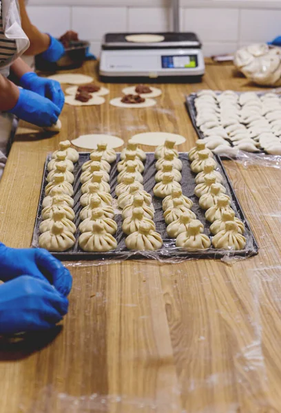 The process of preparing food from dough in the kitchen. High quality photo