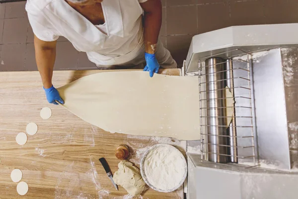 The process of preparing food from dough in the kitchen. High quality photo