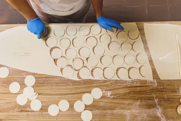 The process of preparing food from dough in the kitchen. High quality photo