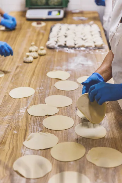 The process of preparing food from dough in the kitchen. High quality photo