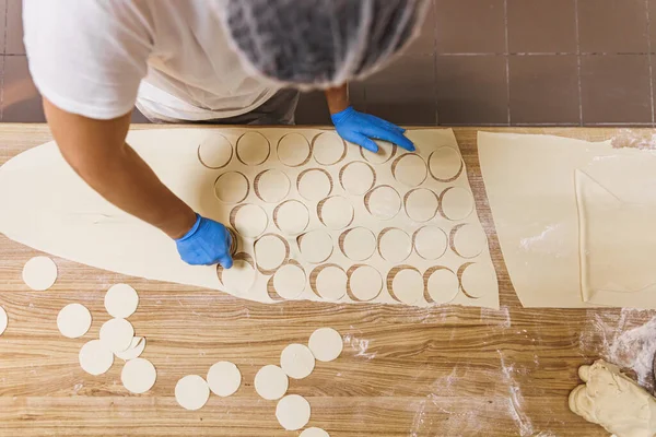 The process of preparing food from dough in the kitchen. High quality photo