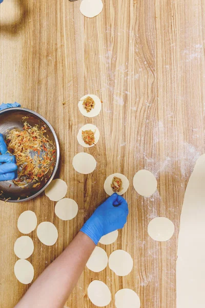 The process of preparing food from dough in the kitchen. High quality photo