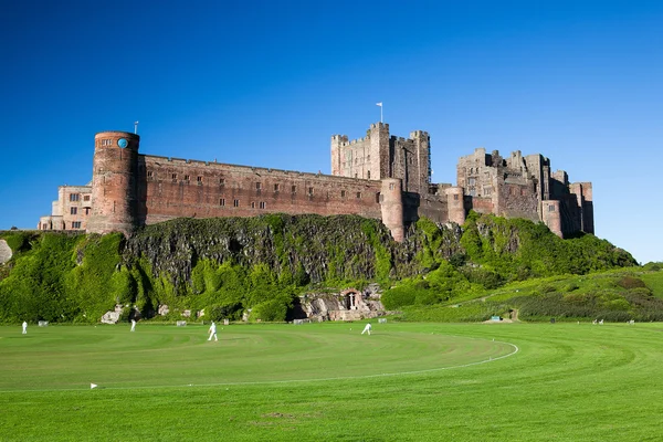 Bamburgh Castle and cricket course — Stock Photo, Image