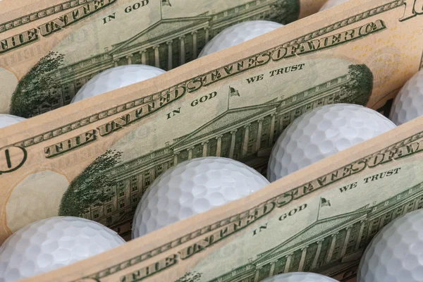 El dinero y pelotas de golf —  Fotos de Stock