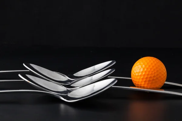 Cucchiai e palline da golf — Foto Stock