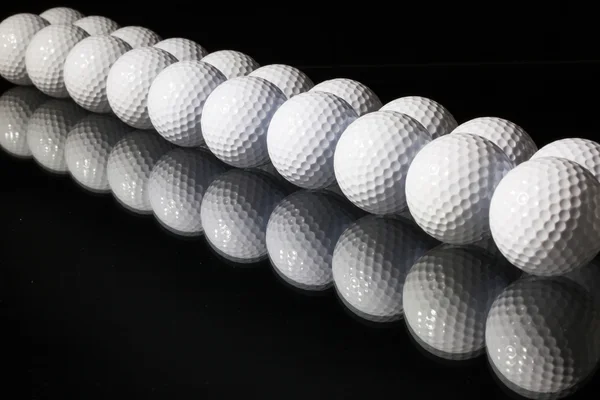 Balles de golf sur fond noir — Photo