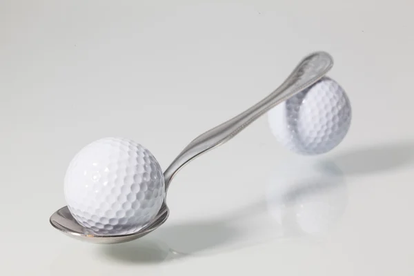 Colher e bolas de golfe — Fotografia de Stock