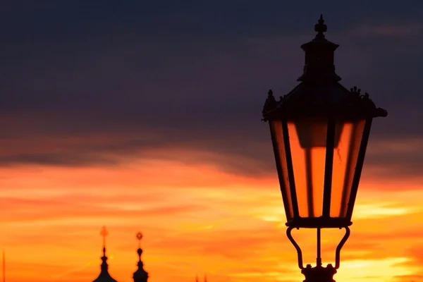 Sunrise in the street lamp above Prague — Stock Photo, Image