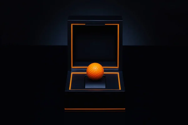 Black box with orange golf ball. Velvet case with golf ball. Romantic precious golf gift. Creative image.