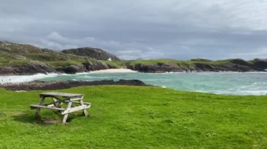 Amazing Clachtoll Beach in Lochinver, Scotland. Clachtoll Beach is a popular beach with some rugged terrain, including the Split Rocks