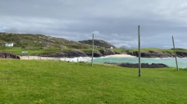 Amazing Clachtoll Beach in Lochinver, Scotland. Clachtoll Beach is a popular beach with some rugged terrain, including the Split Rocks