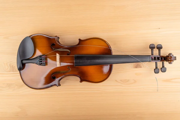 Top View Violin String Lying Wooden Background Copy Space — стоковое фото