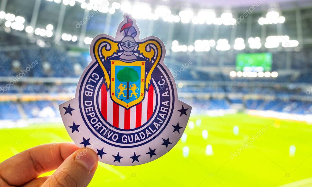 September 12, 2021, Guadalajara, Mexico. The emblem of the football club C.D. Guadalajara against the backdrop of a modern stadium.