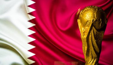 6 Ekim 2021 Doha, Katar. Katar bayrağının arka planına karşı FIFA Dünya Kupası.