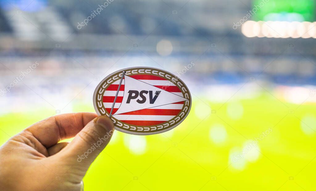 September 12, 2021, Eindhoven, Netherlands. The emblem of the PSV Eindhoven football club against the background of a modern stadium.