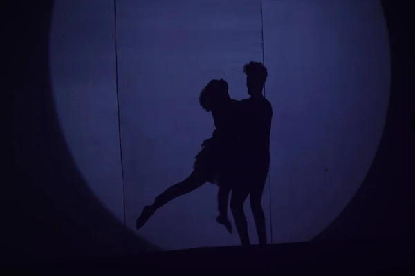 Dancers silhouette on a stage