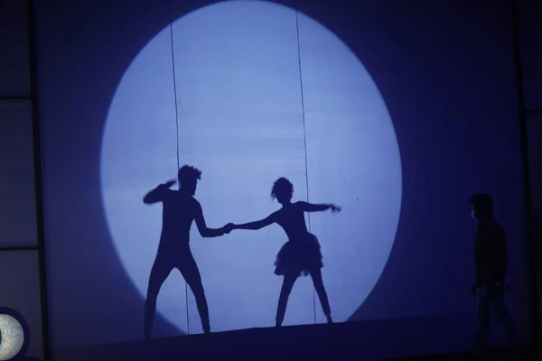 Dancers silhouette on a stage