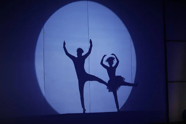 Dancers silhouette on a stage