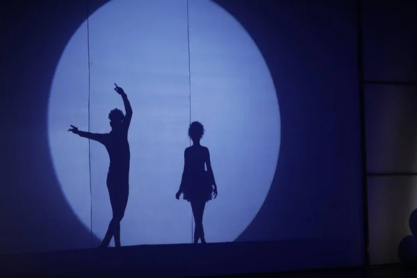 Dancers silhouette on a stage