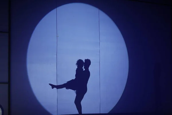 Dancers silhouette on a stage