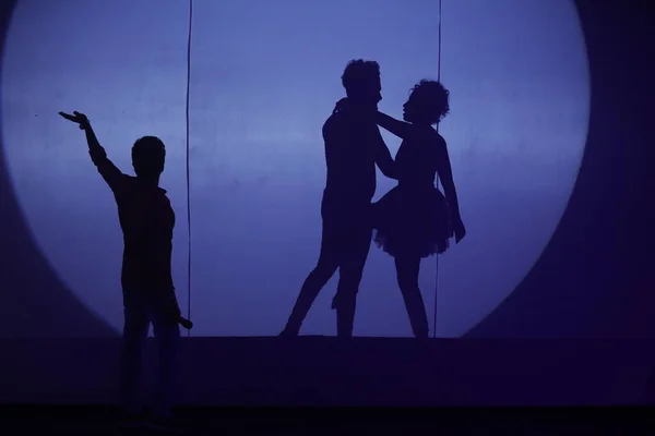 Dancers silhouette on a stage