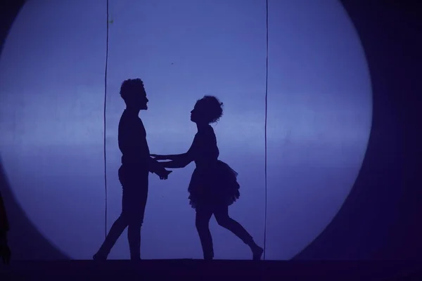 Dancers silhouette on a stage