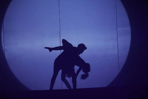 Dancers silhouette on a stage