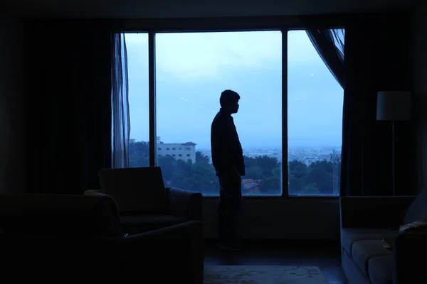 Silhouette of a Man at window