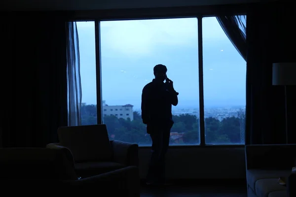 Silhouette of a Man at window