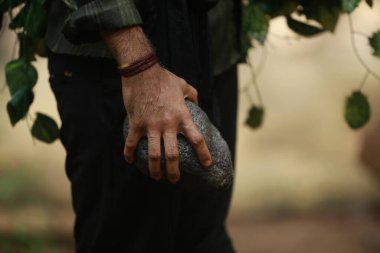 Male Model hand with stone