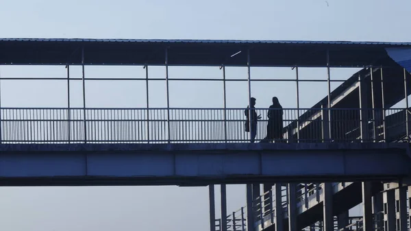 Silhouettes Foot Bridge — стоковое фото