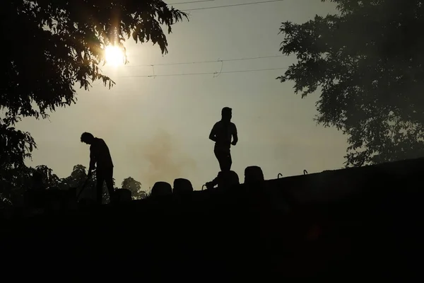 Silhouettes of People on the Road