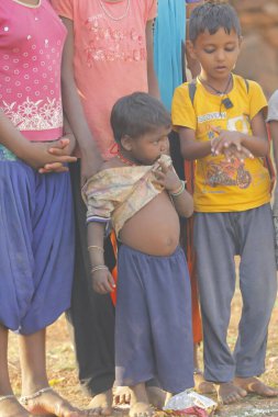 Indian poor Mother and child watching Hyderabad India 2nd Aug 2022