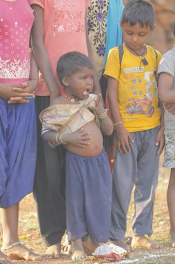 Indian poor Mother and child watching Hyderabad India 2nd Aug 2022