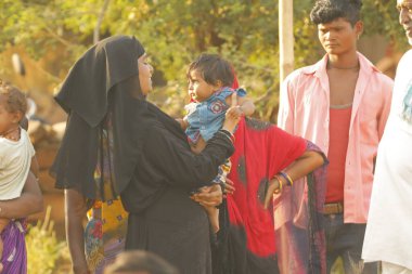 Indian poor Mother and child watching Hyderabad India 2nd Aug 2022