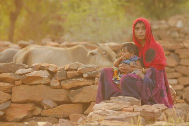Indian poor Mother and child watching Hyderabad India 2nd Aug 2022