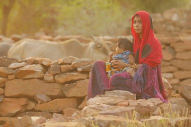 Indian poor Mother and child watching Hyderabad India 2nd Aug 2022