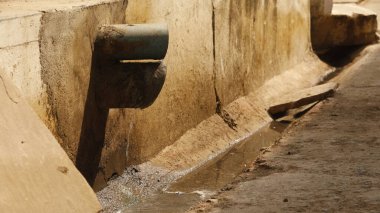 Drainage water flowing from pipe