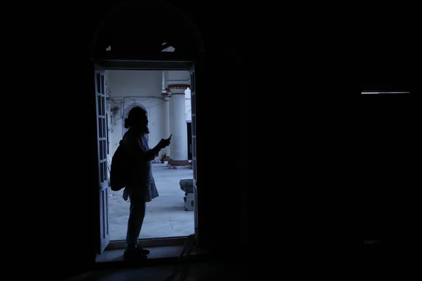 silhouette of man at Door