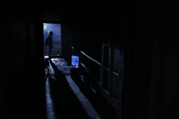 silhouette of man at Door