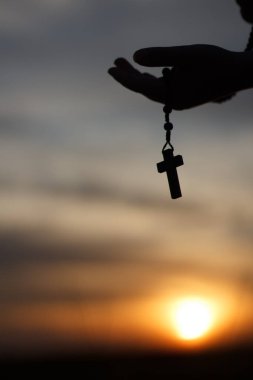 Black rosary at sunset