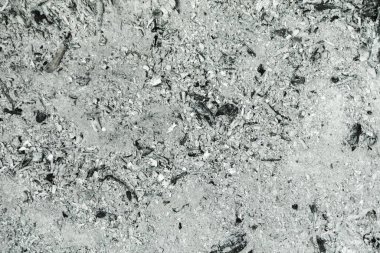 Fırının arka planındaki gri kül, şöminenin ahşap külleri. Kül dokusu, arkaplan olarak kullanılabilir